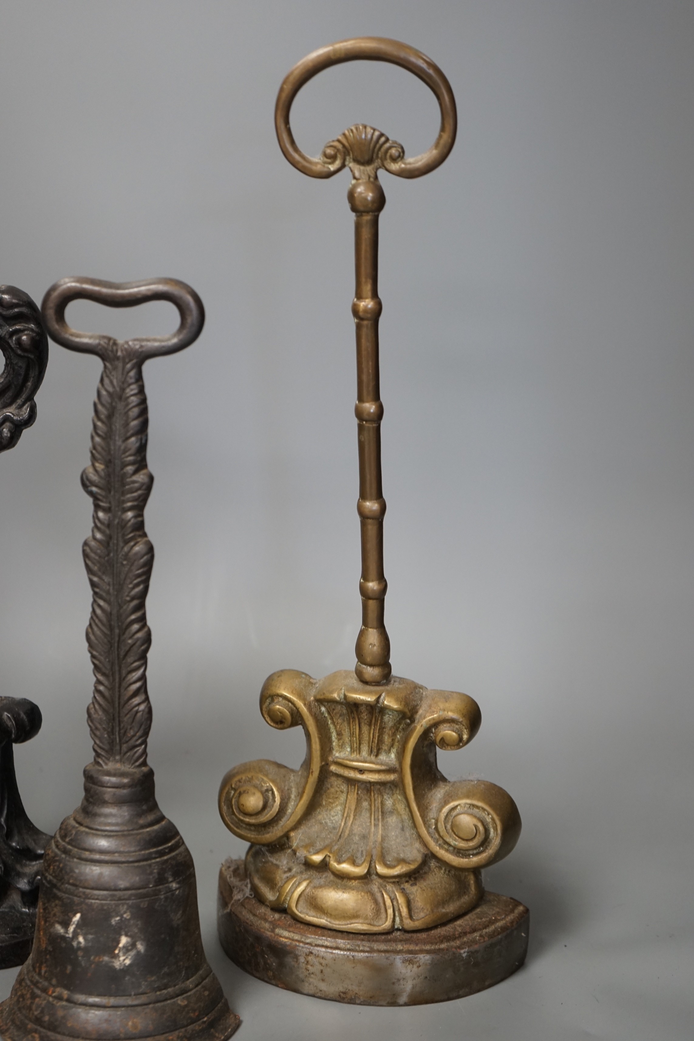 Four cast iron Victorian assorted door stops, tallest 38cm